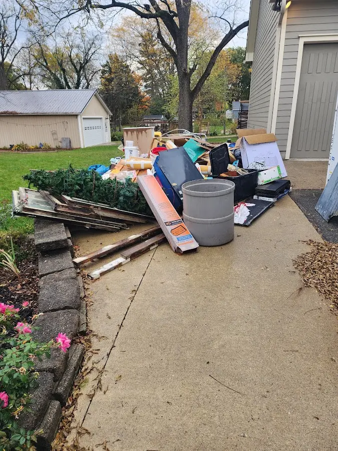 Dumpster being loaded with debris for 10 Yard Dumpster Rental in Aberdeen